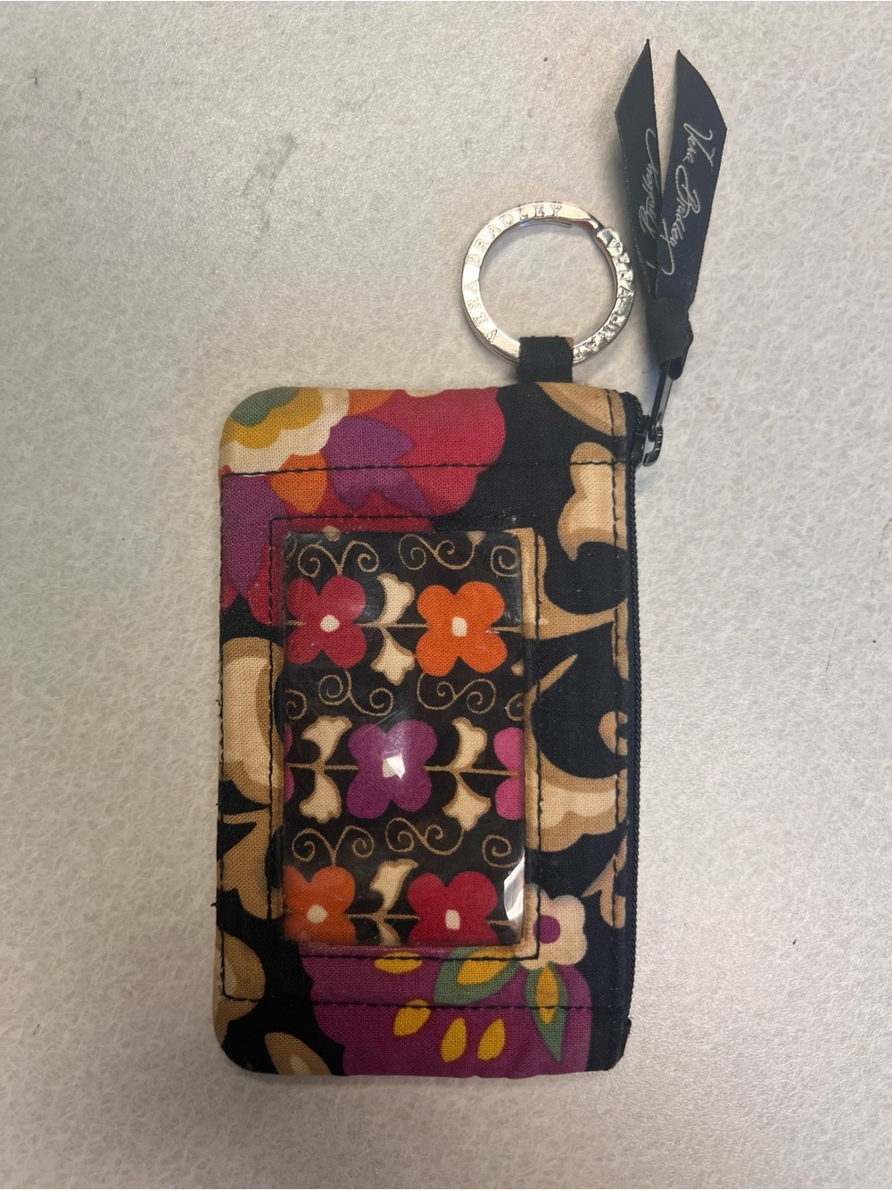 Zip ID case is featured in the retired “Suzani”pattern with floral design. - Picture 2 of 5